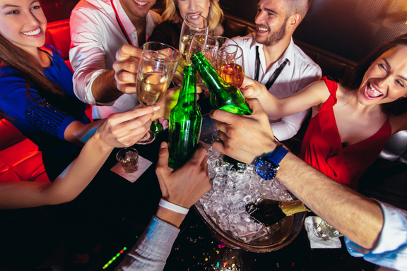 Friends late night drinking at nightclub